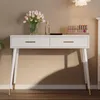 A white vanity table with gold accents, decorated with a vase of tulips, a perfume bottle, and makeup. Podgląd zdjęcia produktu