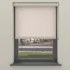 A roller blind is shown in a window frame, with a street scene visible through the window. Produktbild-Vorschau