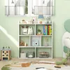 A white geometric bookshelf filled with toys and books in a child's room. Produktbild-Vorschau