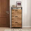 A shoe cabinet with three drawers is shown in a hallway next to a wooden door. Náhľad obrázku produktu