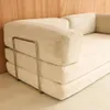 A close-up view of a beige corduroy sofa with a chrome frame. Anteprima dell’immagine prodotto