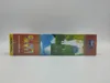 The side view of a board game box with colorful illustrations of llamas and landscapes. Produktbild-Vorschau