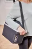 A person is carrying a portable cooler bag over their shoulder. Podgląd zdjęcia produktu