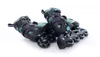 A pair of black and green inline skates are shown on a white background. Anteprima dell’immagine prodotto
