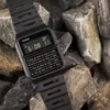 A black Casio calculator watch is placed on a pile of rocks. Produktbild-Vorschau
