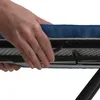 A close-up shot of a person's hands adjusting a blue ironing board. Produktbild-Vorschau