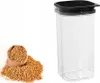 A clear plastic storage container with a black lid is shown next to a burlap sack filled with small, light brown seeds, with some seeds spilled around it. Anteprima dell’immagine prodotto