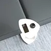 A white side table with a smartphone and a cup of coffee on it, placed on a gray carpet next to a gray sofa. Podgląd zdjęcia produktu