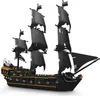 A black pirate ship model with black sails and gold trim, displayed on a white background. Voir les images du produit