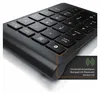 A close-up, angled view of a black Bluetooth numeric keypad. Náhled obrázku produktu