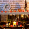 Two scenes showing LED tea lights used for decoration. The top scene shows them on a mantelpiece with a wreath and decorative items. The bottom scene shows them on a table with a lantern. Produktbild-Vorschau