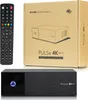 A satellite receiver, its remote control, and its packaging are displayed. Podgląd zdjęcia produktu
