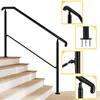 A black metal handrail installed on a wooden staircase. Produktbild-Vorschau