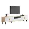 A modern TV stand with a marble-look top and fluted white doors, featuring gold accents and black legs, with a TV mounted above it. Podgląd zdjęcia produktu