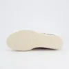 The sole of a leopard-print sneaker is shown against a white background. Voir les images du produit