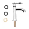 A silver faucet with accessories on a white background. Podgląd zdjęcia produktu