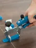 A hand is using a tile leveling tool to adjust tiles on a floor. Náhľad obrázku produktu