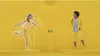 Two children are playing a game in a yellow room. Produktbild-Vorschau
