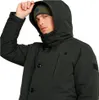 A man wearing a dark green hooded jacket and a green beanie. Produktbild-Vorschau