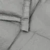 A close-up view of the stitching and fabric of a gray weighted blanket. Náhľad obrázku produktu