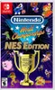 The image is a marketing graphic for the Nintendo World Championships NES Edition game, featuring pixelated characters from various Nintendo games surrounding a golden trophy. Podgląd zdjęcia produktu