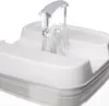 A close-up view of the lid of a white storage container with a clear plastic handle. Produktbild-Vorschau