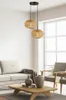 A living room scene with a sofa, coffee table, chairs, and a pendant light. Náhled obrázku produktu