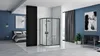 A modern bedroom with an open-plan bathroom featuring a black framed shower cabin. Náhľad obrázku produktu