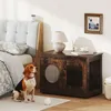 A dog sits in front of a wooden pet enclosure next to a bed. Náhled obrázku produktu