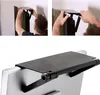 A collage of images showing a person installing a shelf on top of a TV, and a close-up of the shelf attached to a monitor. Produktbild-Vorschau