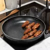 A frying pan with food being cooked on a stovetop. Náhľad obrázku produktu