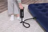 A person is using a foot pump to inflate a blue air mattress. Anteprima dell’immagine prodotto