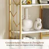 A close-up view of a white shelf with decorative items, including vases and a sculpture, on a gold-colored geometric shelf frame. Produktbild-Vorschau