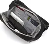 The inside of a black sling bag is shown, with various items organized within its compartments. Anteprima dell’immagine prodotto