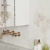 A modern bathroom vanity with a mirrored cabinet and gold fixtures. Podgląd zdjęcia produktu