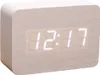 A digital clock with a wood-like finish displaying the time. Produktbild-Vorschau