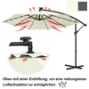 A beige cantilever umbrella with LED lights and a stand, shown with arrows indicating airflow for ventilation. Produktbild-Vorschau