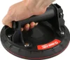 A hand is holding a suction cup lifter. Produktbild-Vorschau