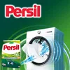 A washing machine with a t-shirt being washed, next to a box of Persil detergent. Náhľad obrázku produktu