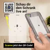 A person is using a smartphone to scan a QR code displayed on a virtual representation of a cabinet, likely for augmented reality visualization. Podgląd zdjęcia produktu