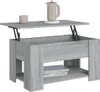 A lift-top coffee table with a storage compartment and a lower shelf, shown with a teapot and a cup on top. Produktbild-Vorschau
