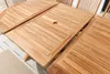 A close-up view of a wooden garden table with an extension leaf. Produktbild-Vorschau