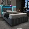 A modern bedroom with a bed featuring LED lighting. Produktbild-Vorschau