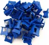 A pile of blue tile leveling clips. Produktbild-Vorschau