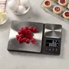 A digital kitchen scale with raspberries on the weighing platform, next to bowls of eggs and butter, and cookies on a cooling rack. Voir les images du produit