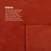 A close-up of a red blanket showing its stitching and texture. Náhled obrázku produktu