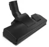 A black vacuum cleaner floor head accessory on a white background. Náhled obrázku produktu