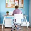 A person is working at a desk in a home office setting. Produktbild-Vorschau