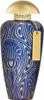 A perfume bottle with a blue and gold patterned design. Náhled obrázku produktu