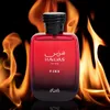 A bottle of Rasasi Hawas Fire perfume is presented against a backdrop of flames. Voir les images du produit